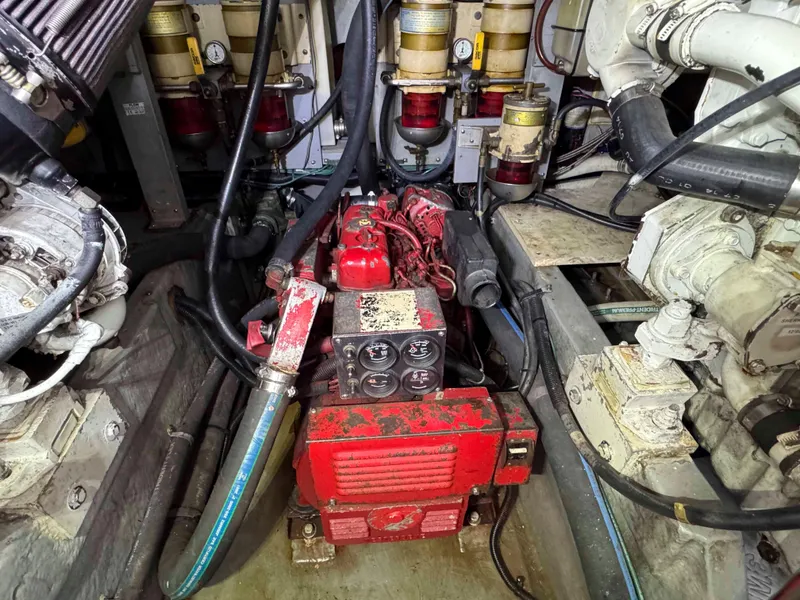 Slide: The Image of Engine room of a 1998 Sea Ray 440 Express Bridge with visible machinery and components. - 30