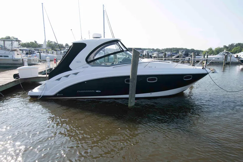 The Image of 2014 Chaparral 310 Signature boat docked at marina. - 0
