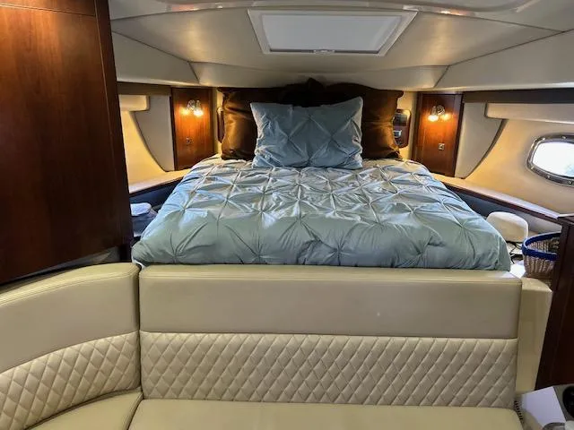 Slide: The Image of Luxurious interior of 2014 Chaparral 310 Signature yacht with elegant bedding and seating. - 18