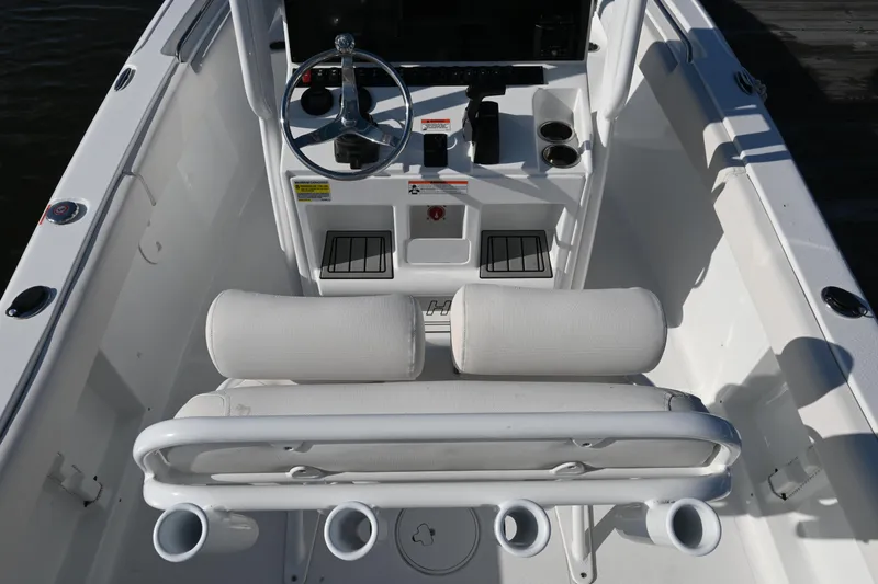 Slide: The Image of 2021 Sea Hunt Ultra 219 boat interior with steering console and seating. - 16