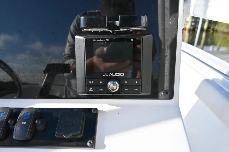 Slide: The Image of JL Audio system on 2021 Sea Hunt Ultra 219 boat dashboard. - 18