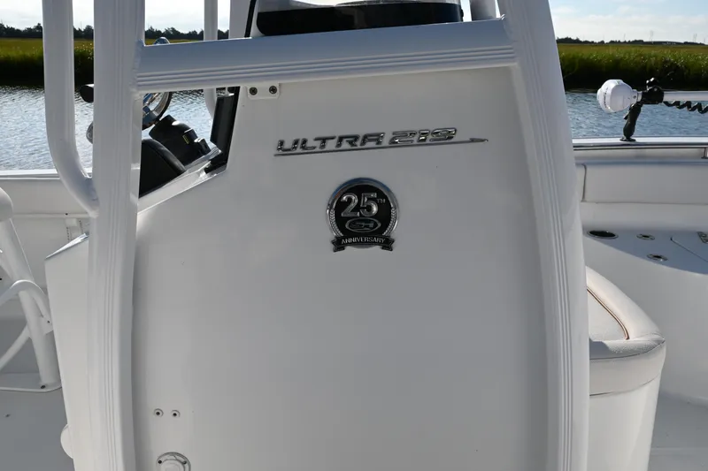 Slide: The Image of 2021 Sea Hunt Ultra 219 boat console with 25th anniversary emblem. - 26