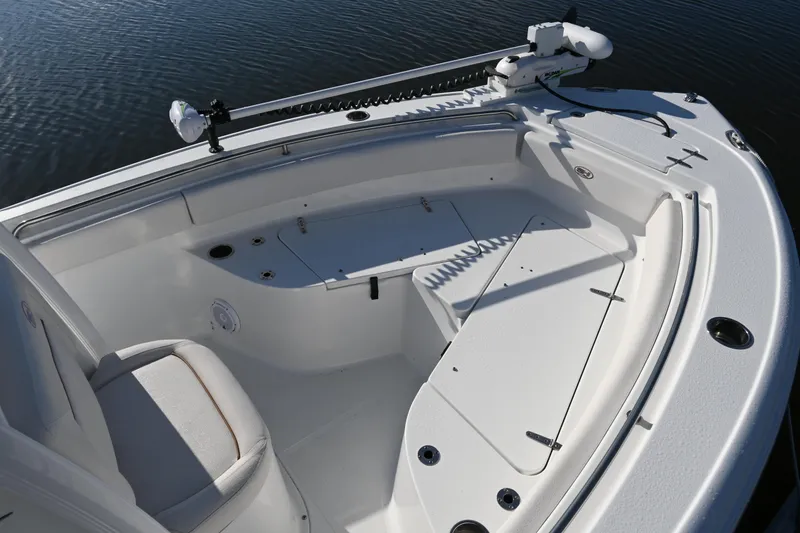 Slide: The Image of 2021 Sea Hunt Ultra 219 boat interior with seating and storage compartments. - 27