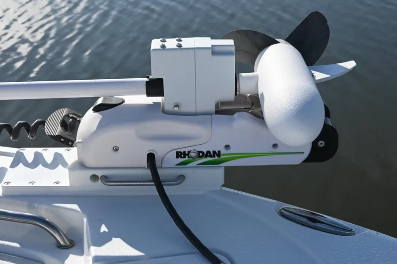 Slide: The Image of Rhodan trolling motor mounted on 2021 Sea Hunt Ultra 219 boat, near water surface. - 33