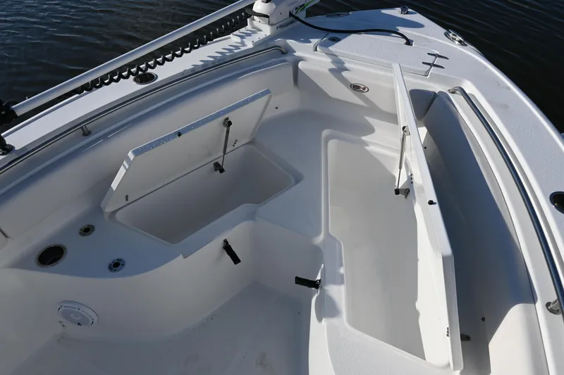 Slide: The Image of 2021 Sea Hunt Ultra 219 boat interior with open storage compartments. - 35