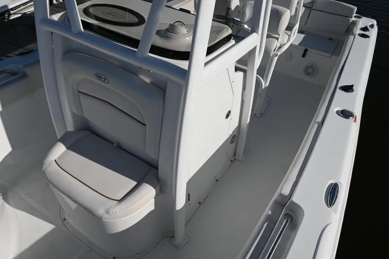 Slide: The Image of 2021 Sea Hunt Ultra 219 boat interior with seating and console, showcasing modern design. - 36