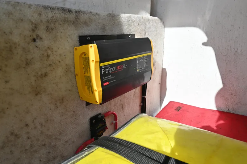Slide: The Image of Battery charger installed on 2021 Sea Hunt Ultra 219 boat interior. - 38