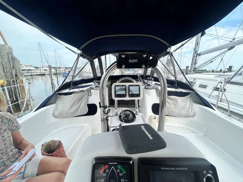 Slide: The Image of Cockpit view of a 1994 Hunter Legend 40.5 sailboat at a marina. - 17