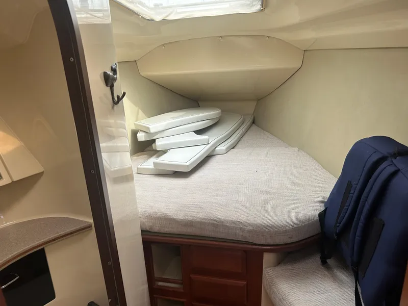 Slide: The Image of Interior cabin of 1994 Hunter Legend 40.5 sailboat with cushions and storage. - 24