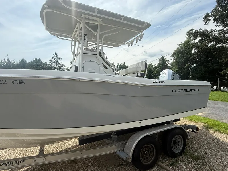 Slide: The Image of 2018 Clearwater 2200CC boat on trailer, side view, outdoors. - 6