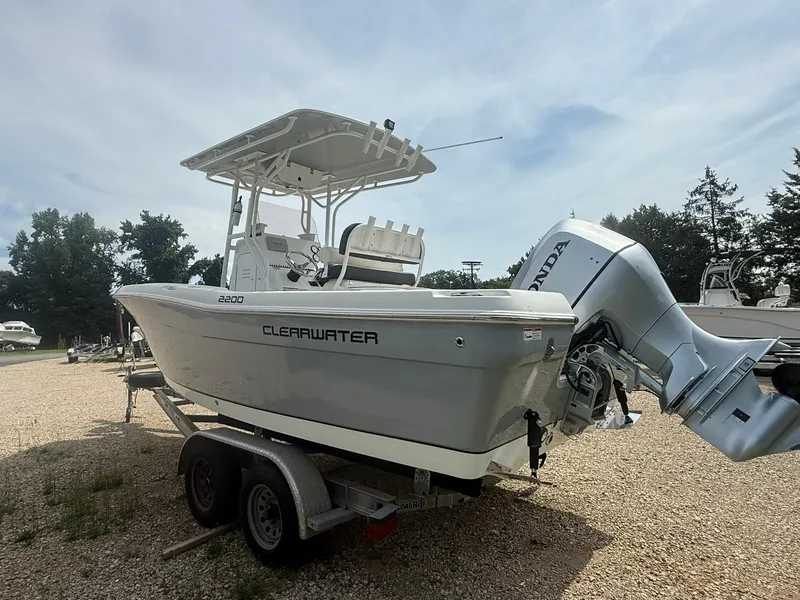 Slide: The Image of 2018 Clearwater 2200CC boat on trailer with Honda outboard motor. - 7