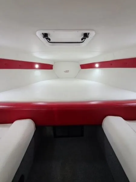 Slide: The Image of Interior cabin of 2022 Velocity 290 SC boat with red and white upholstery. - 6