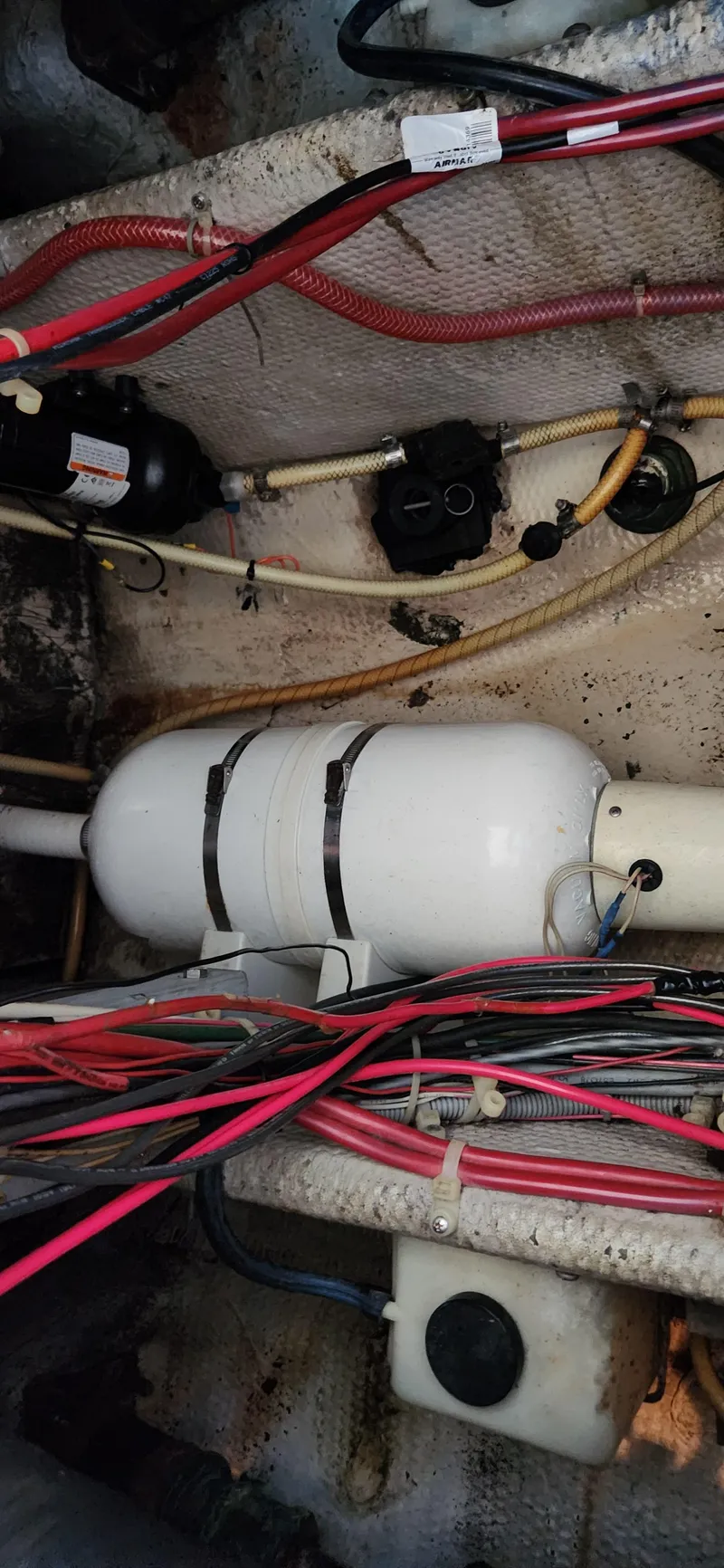 Slide: The Image of Engine compartment of a 1983 Silverton 40 Aft Cabin with visible wiring and components. - 20