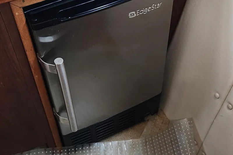 Slide: The Image of EdgeStar mini fridge in 1983 Silverton 40 Aft Cabin yacht interior. - 32