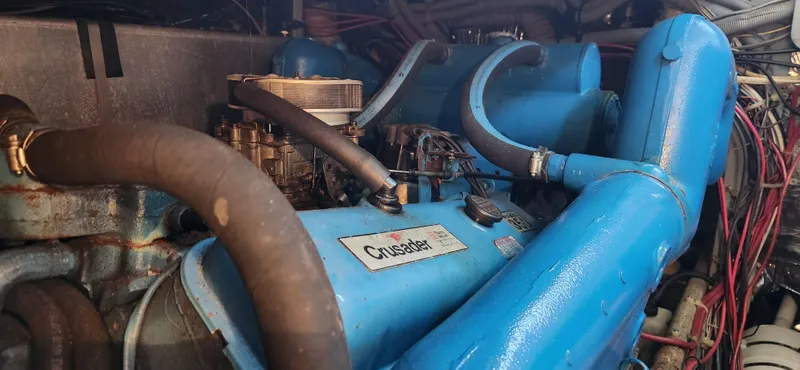 Slide: The Image of Engine compartment of a 1983 Silverton 40 Aft Cabin with blue Crusader engine. - 33
