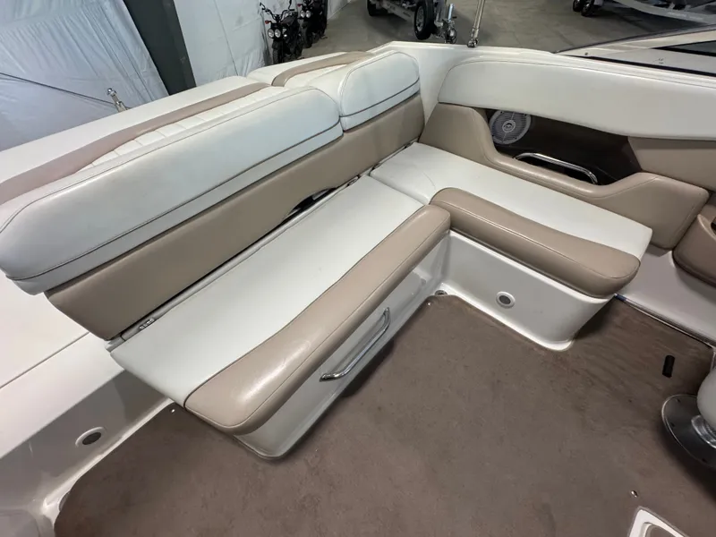 Slide: The Image of 2003 Regal 2200 boat interior with beige and white seating. - 6