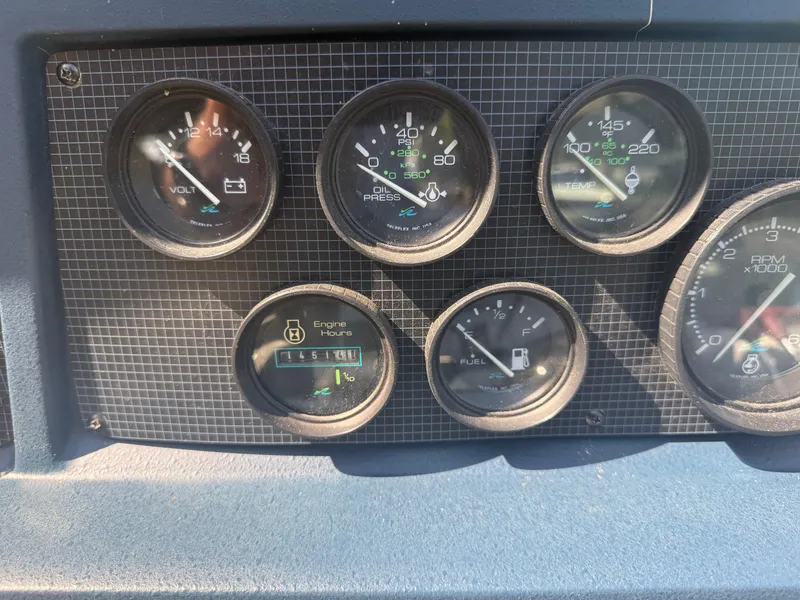 Slide: The Image of Dashboard gauges of a 1989 Sea Ray 390 Express Cruiser boat. - 15