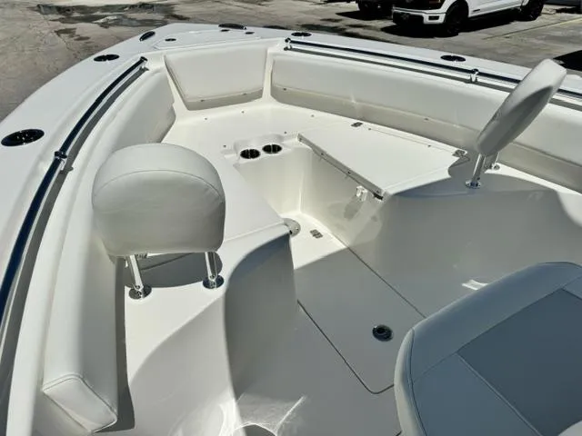 Slide: The Image of 2026 Key West 239 FS boat interior with seating and cup holders, showcasing modern design. - 10