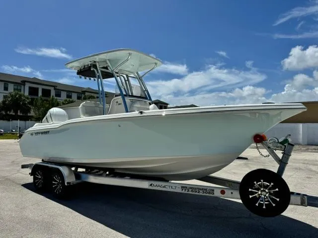 Slide: The Image of 2026 Key West 239 FS boat on trailer under clear blue sky. - 3