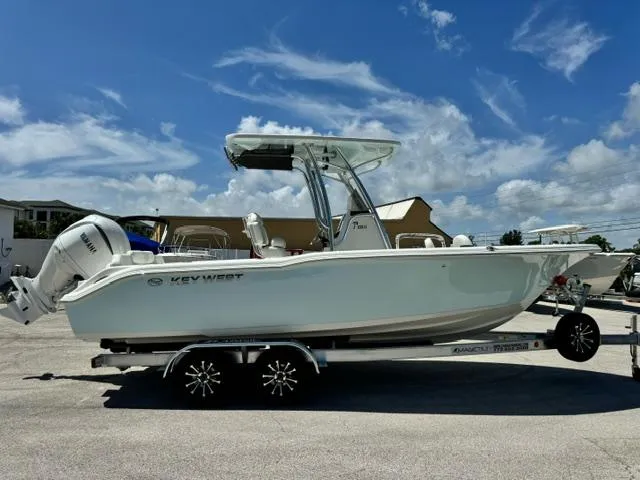 Slide: The Image of 2026 Key West 239 FS boat on trailer under clear blue sky. - 4