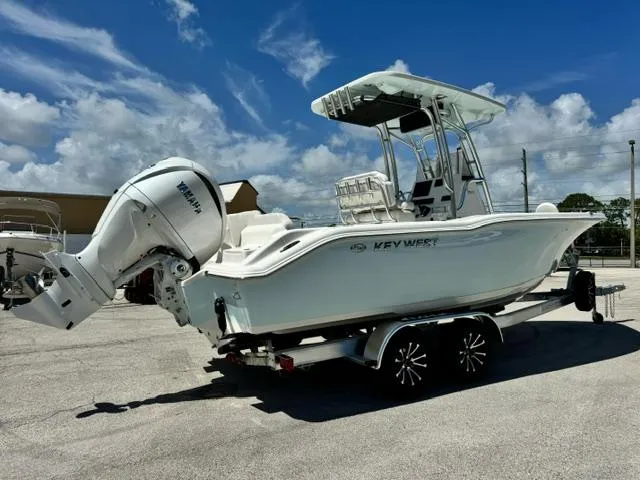 Slide: The Image of 2026 Key West 239 FS boat on trailer under clear blue sky. - 5