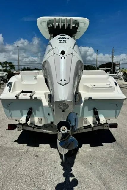 Slide: The Image of 2026 Key West 239 FS boat with powerful outboard motor, viewed from the rear. - 7
