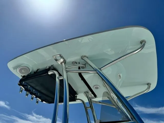 Slide: The Image of T-top of 2026 Key West 239 FS boat against clear blue sky. - 8