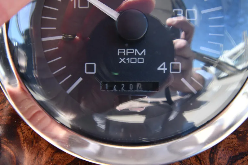 Slide: The Image of Close-up of 1997 Sea Ray 400 Sundancer RPM gauge showing 1420.4 hours. - 13