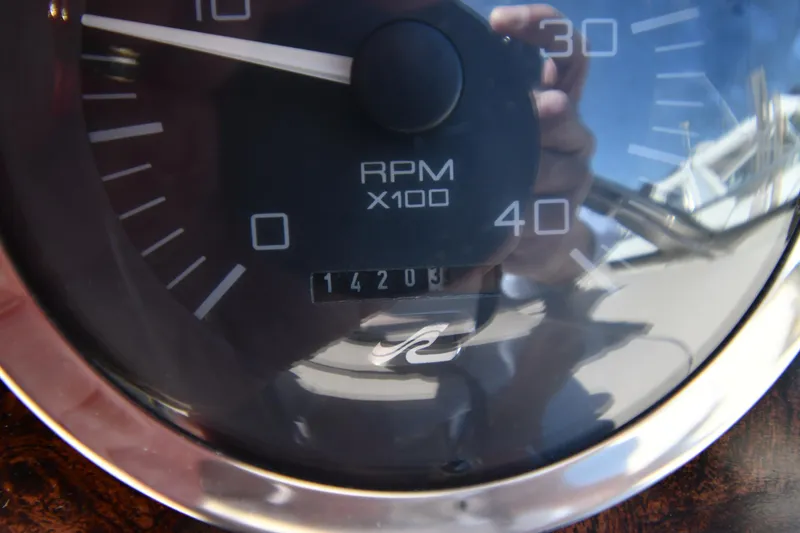 Slide: The Image of Close-up of a 1997 Sea Ray 400 Sundancer RPM gauge showing 1420.3 hours. - 14
