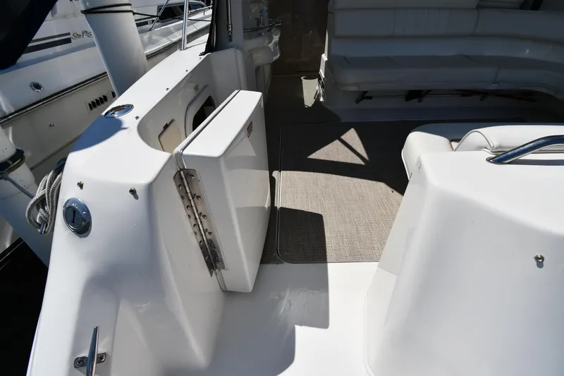 Slide: The Image of 1997 Sea Ray 400 Sundancer yacht interior with seating and open hatch. - 28