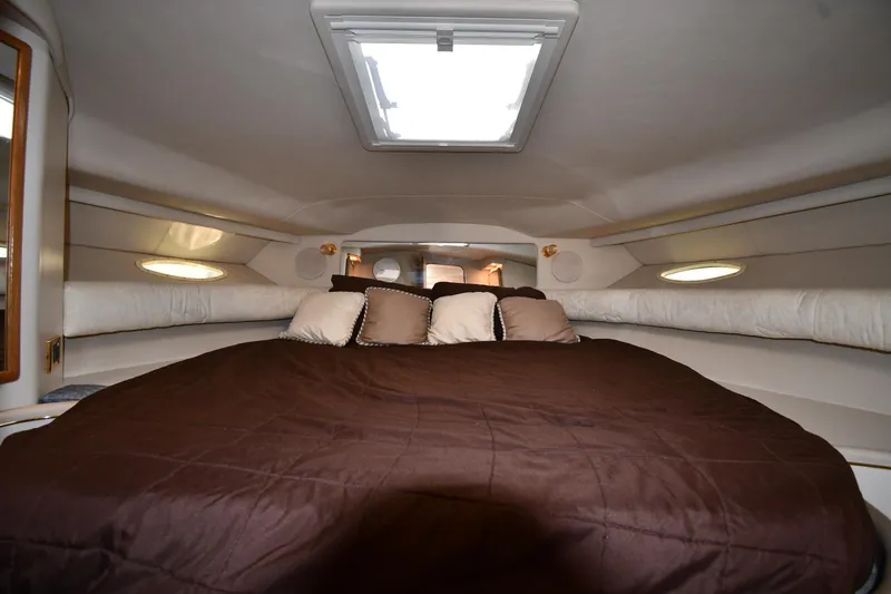 Slide: The Image of Interior cabin of 1997 Sea Ray 400 Sundancer with cozy bed and skylight. - 31
