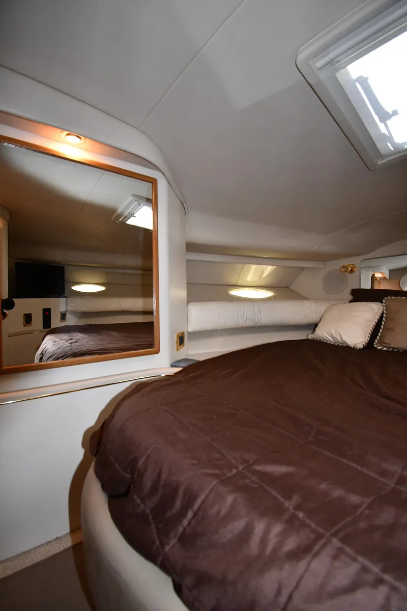 Slide: The Image of Luxurious cabin interior of 1997 Sea Ray 400 Sundancer yacht with cozy bedding. - 33