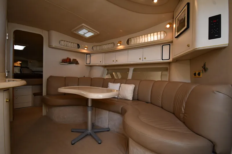 Slide: The Image of Luxurious interior of a 1997 Sea Ray 400 Sundancer yacht with plush seating and elegant decor. - 37