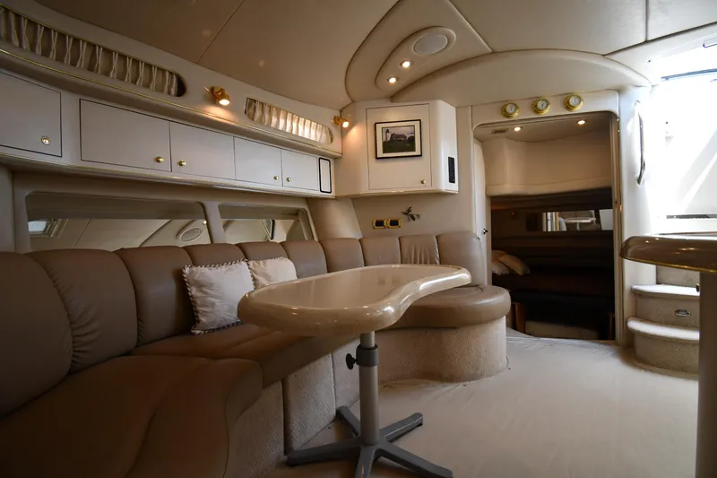 Slide: The Image of Luxurious interior of 1997 Sea Ray 400 Sundancer yacht with plush seating and elegant design. - 44