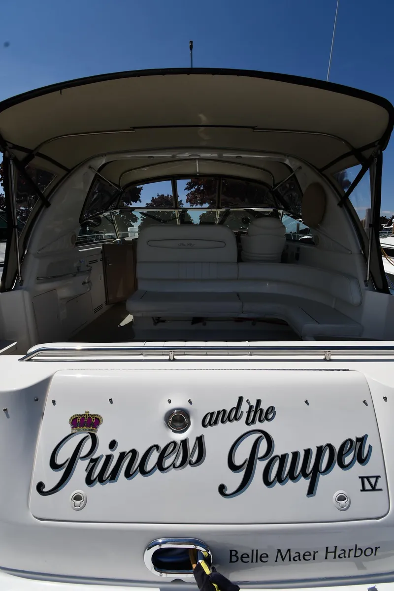 Slide: The Image of 1997 Sea Ray 400 Sundancer yacht at Belle Maer Harbor, named "Princess and the Pauper IV". - 8