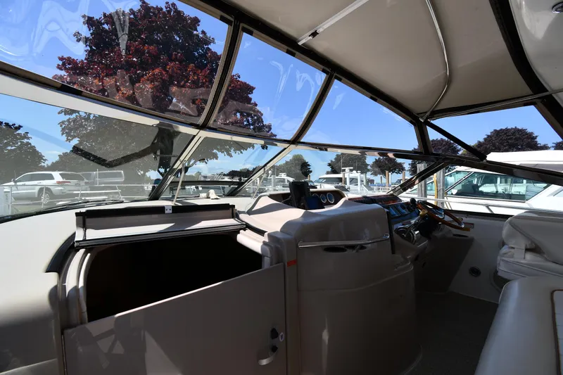 Slide: The Image of Interior view of 1997 Sea Ray 400 Sundancer yacht cockpit with panoramic windows. - 9