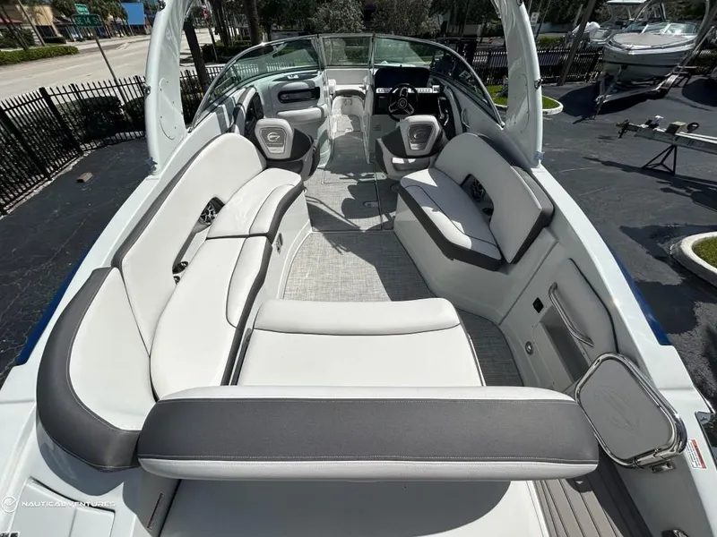 Slide: The Image of 2024 Crownline E290 XS boat interior with spacious seating and modern design. - 10