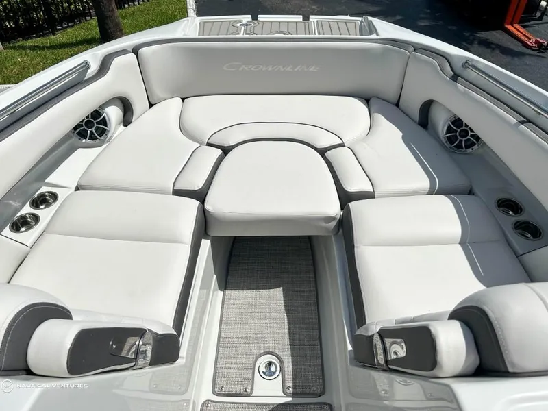 Slide: The Image of 2024 Crownline E290 XS boat interior with luxurious seating and modern design. - 7