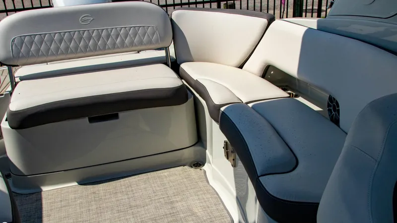 Slide: The Image of 2023 Crownline 290 XSS boat interior with plush seating and modern design. - 19