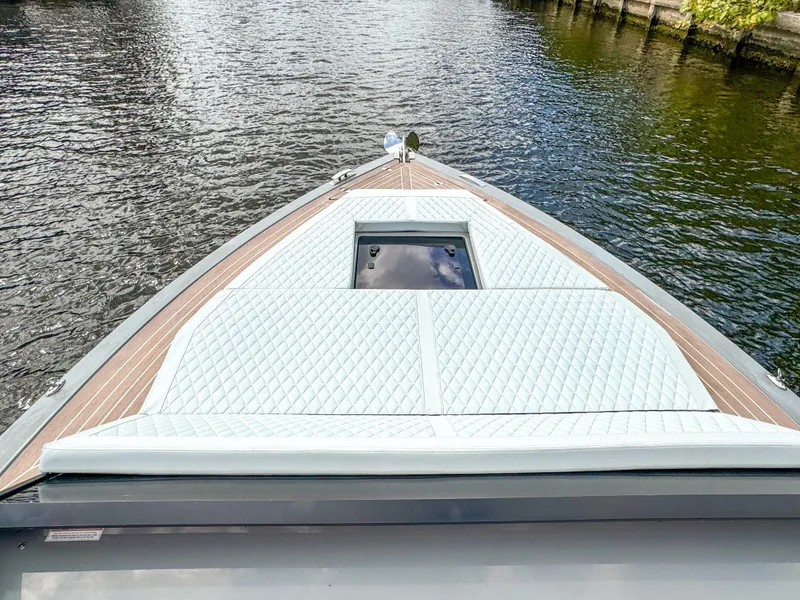 Slide: The Image of 2024 De Antonio Yachts D28 Cruiser on water, featuring sleek deck design. - 15