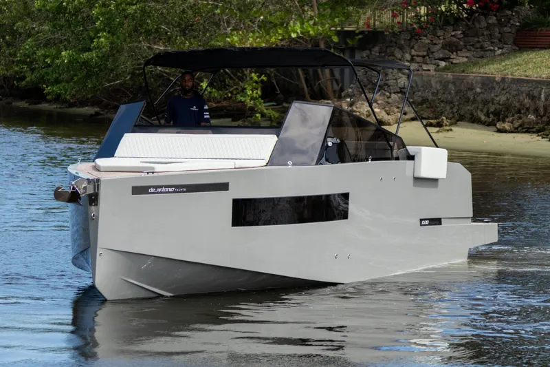Slide: The Image of 2024 De Antonio Yachts D28 Cruiser on calm water, featuring sleek modern design. - 3
