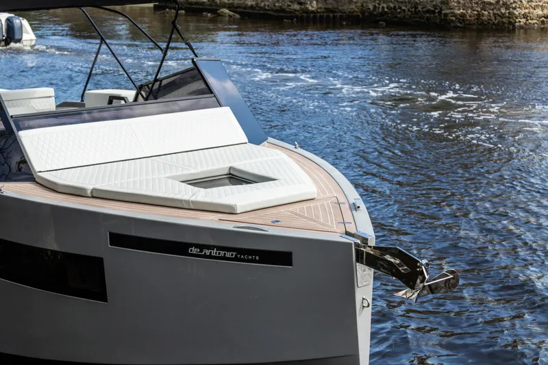 Slide: The Image of 2024 De Antonio Yachts D28 Cruiser on water, showcasing sleek design and luxury features. - 4