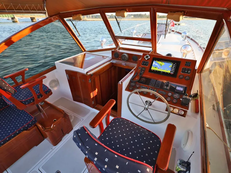 Slide: The Image of Luxurious 1995 Able 44 boat interior with navigation equipment and wooden accents. - 9
