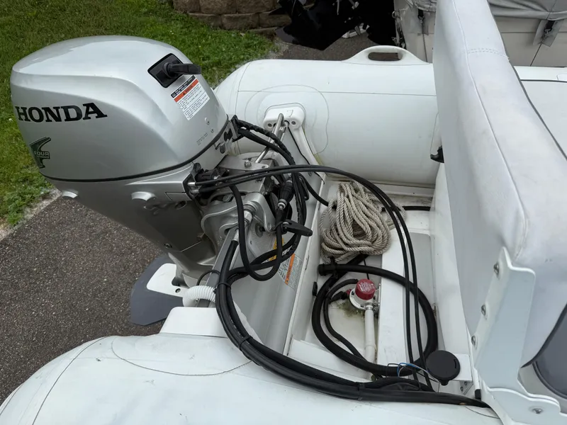 Slide: The Image of 2011 Walker Bay Console Genesis 310FTD with Honda outboard motor, interior view. - 4