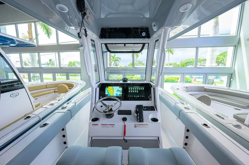 Slide: The Image of 2026 Sportsman Heritage 231 Center Console interior with modern navigation system. - 12