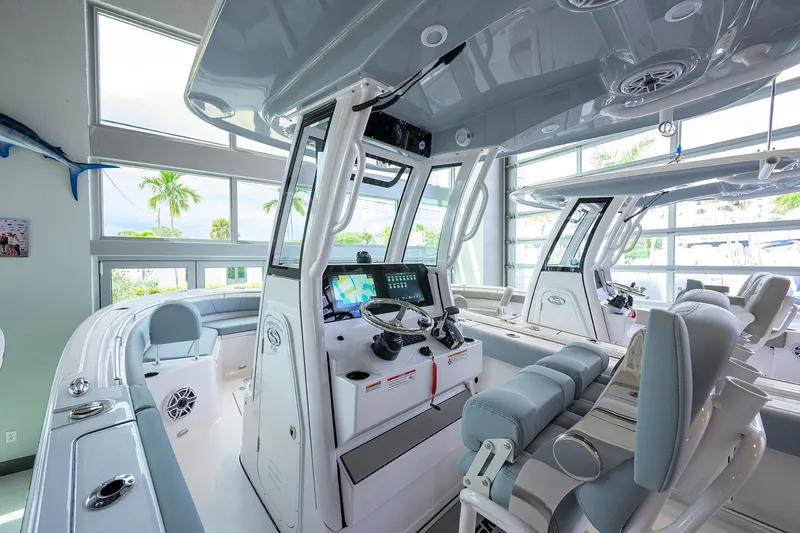 Slide: The Image of 2026 Sportsman Heritage 231 Center Console interior with modern navigation system and seating. - 13