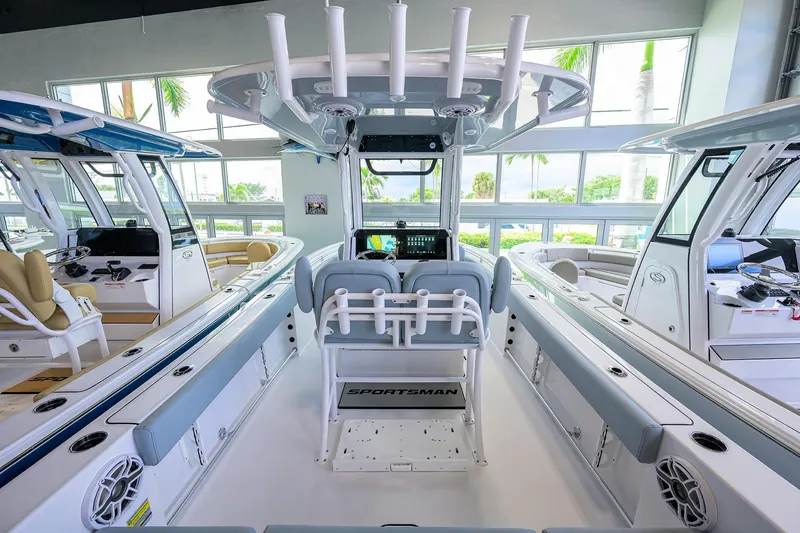 Slide: The Image of 2026 Sportsman Heritage 231 Center Console boat interior with modern seating and controls. - 16