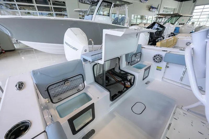 Slide: The Image of 2026 Sportsman Heritage 231 Center Console boat interior with open storage compartments. - 20