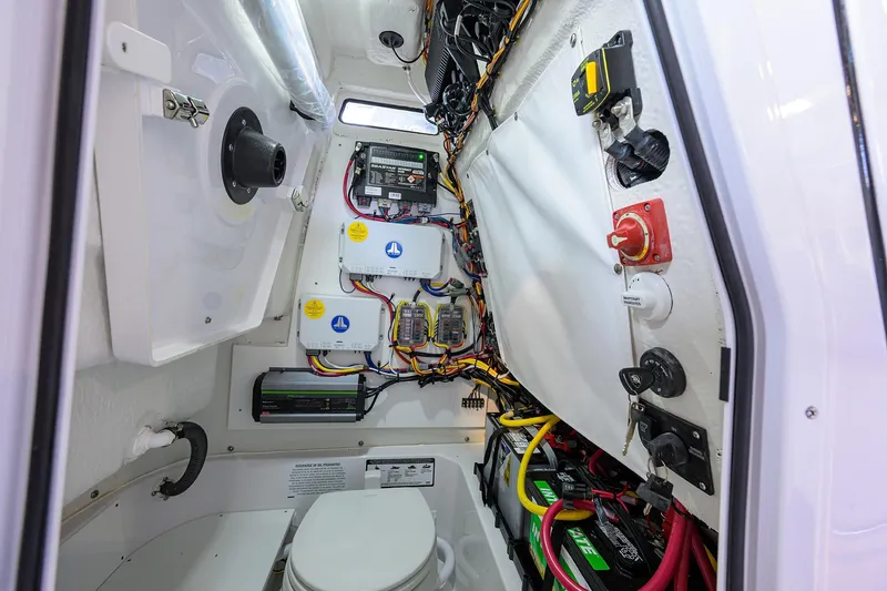 Slide: The Image of 2026 Sportsman Heritage 231 Center Console interior wiring and equipment setup. - 24