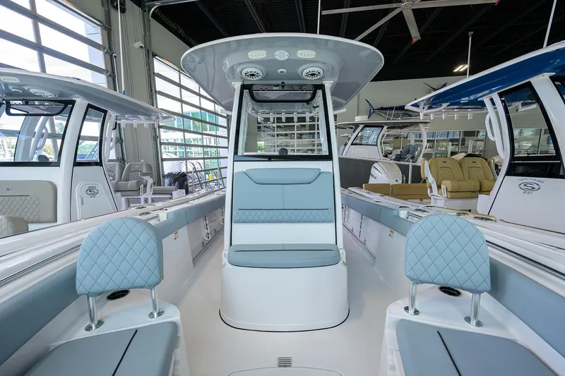 Slide: The Image of 2026 Sportsman Heritage 231 Center Console boat interior in showroom. - 3